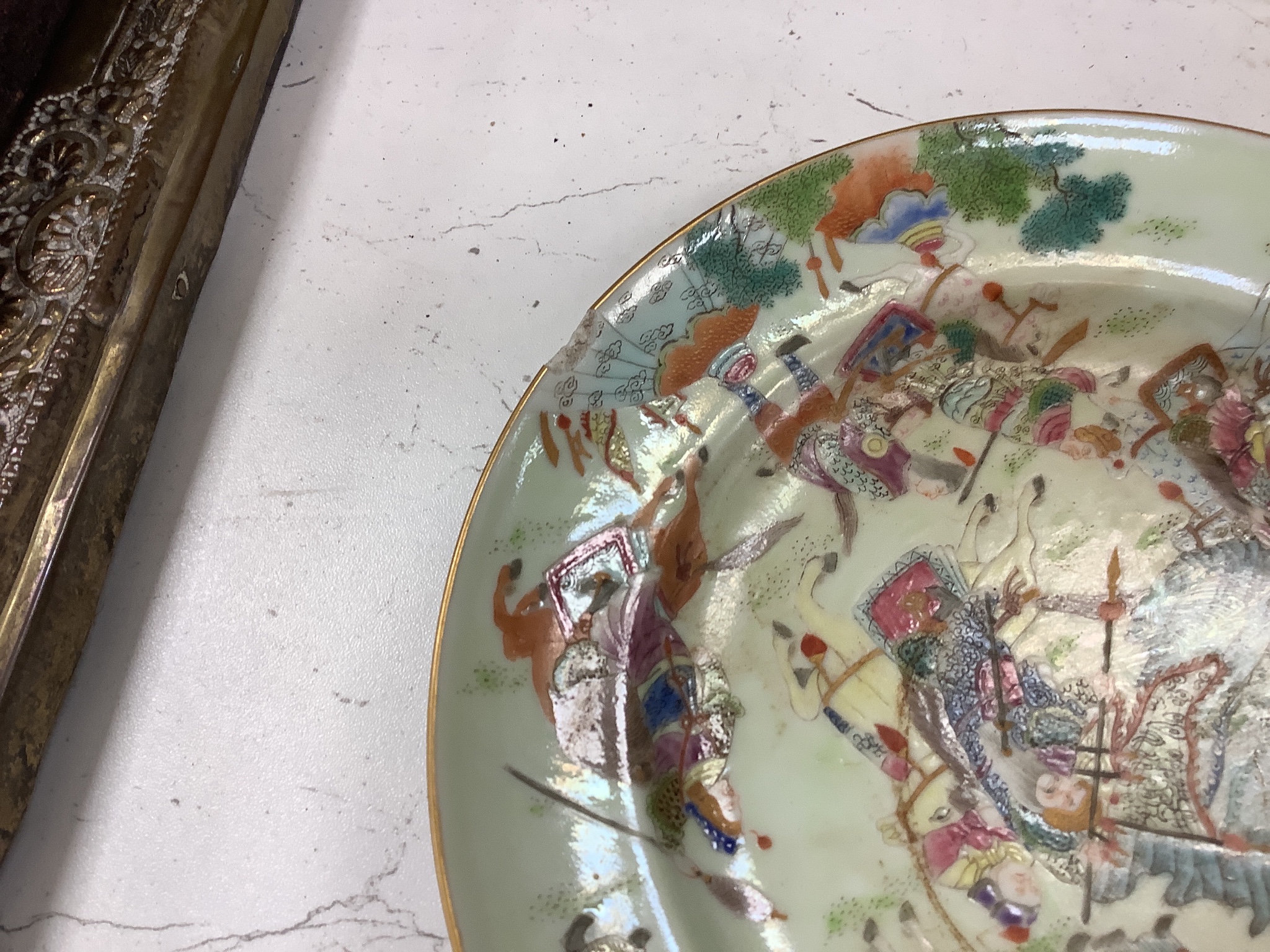 A Chinese famille rose plate and a celadon plate, diameter 24cm